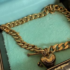 Cool vintage Juicy Couture gold choker with heart charm and toggle clasp.
